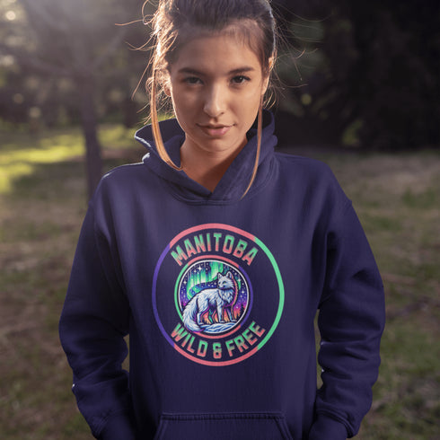 Unleash your wild side with our Manitoba – Wild & Free hoodie, featuring an enchanting graphic of an arctic fox beneath the dazzling northern lights.